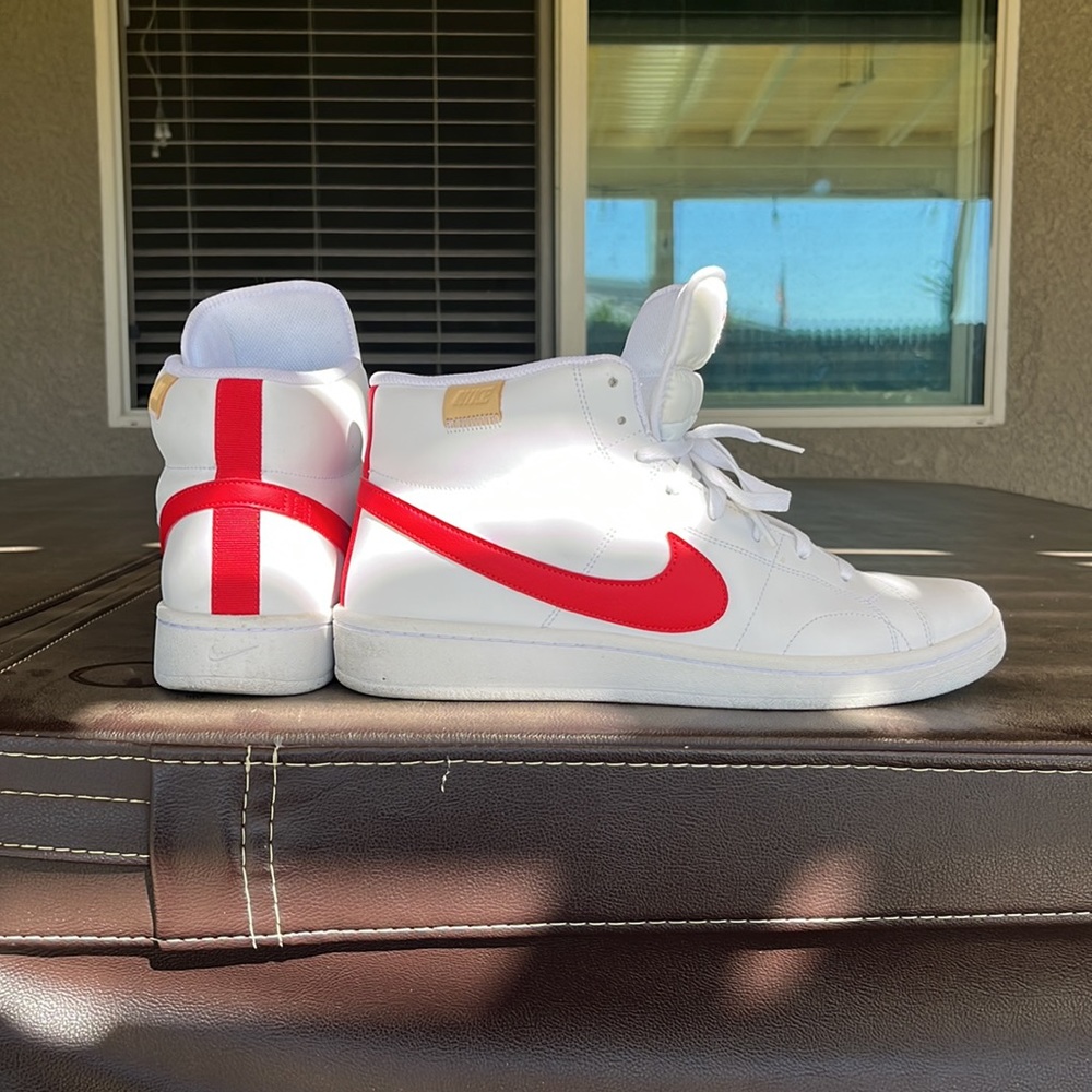 Nike white with red swoosh high tops size 12